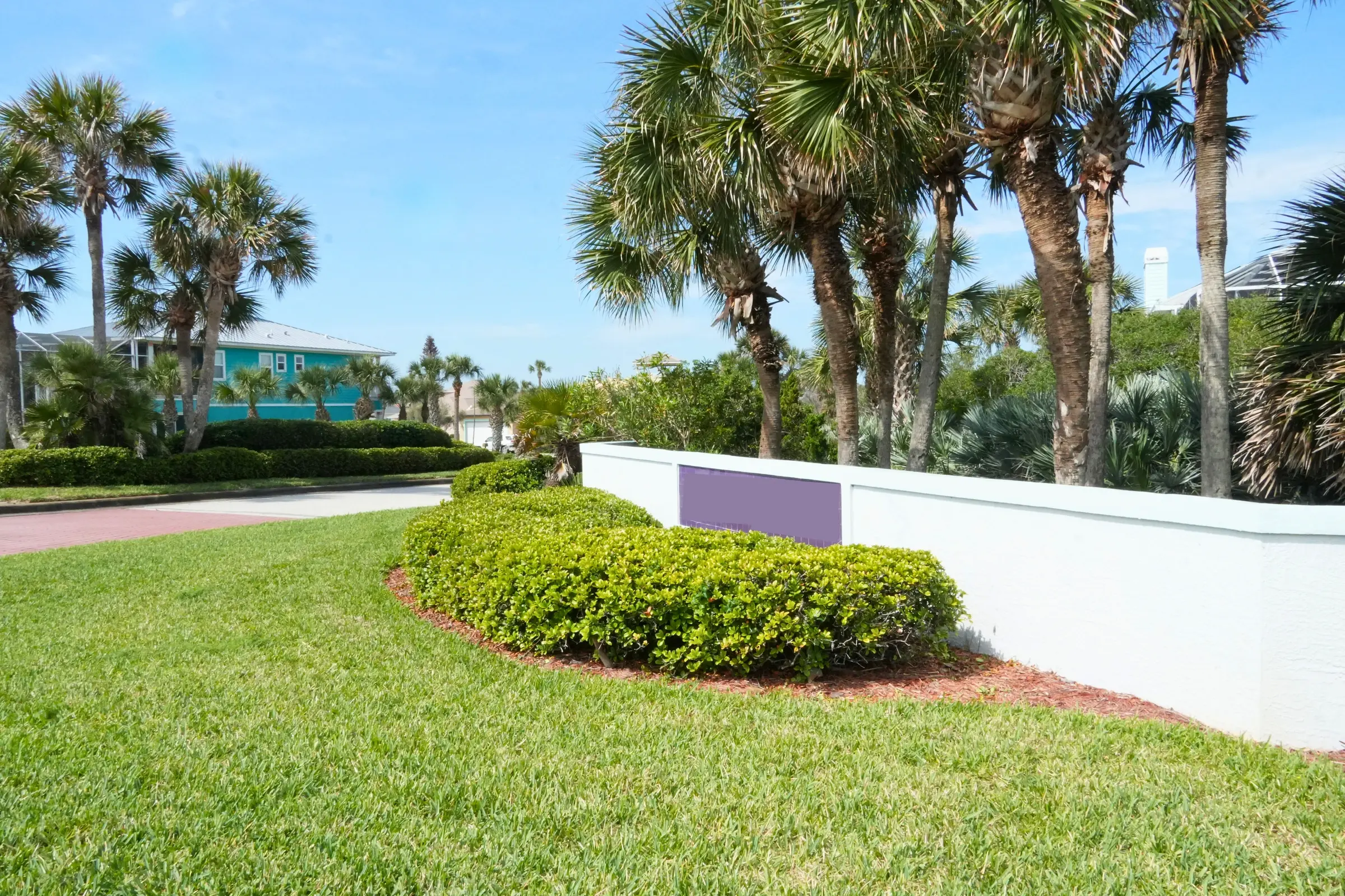 Manicured HOA entrance landscaping irrigated by a WaterCare commercial system