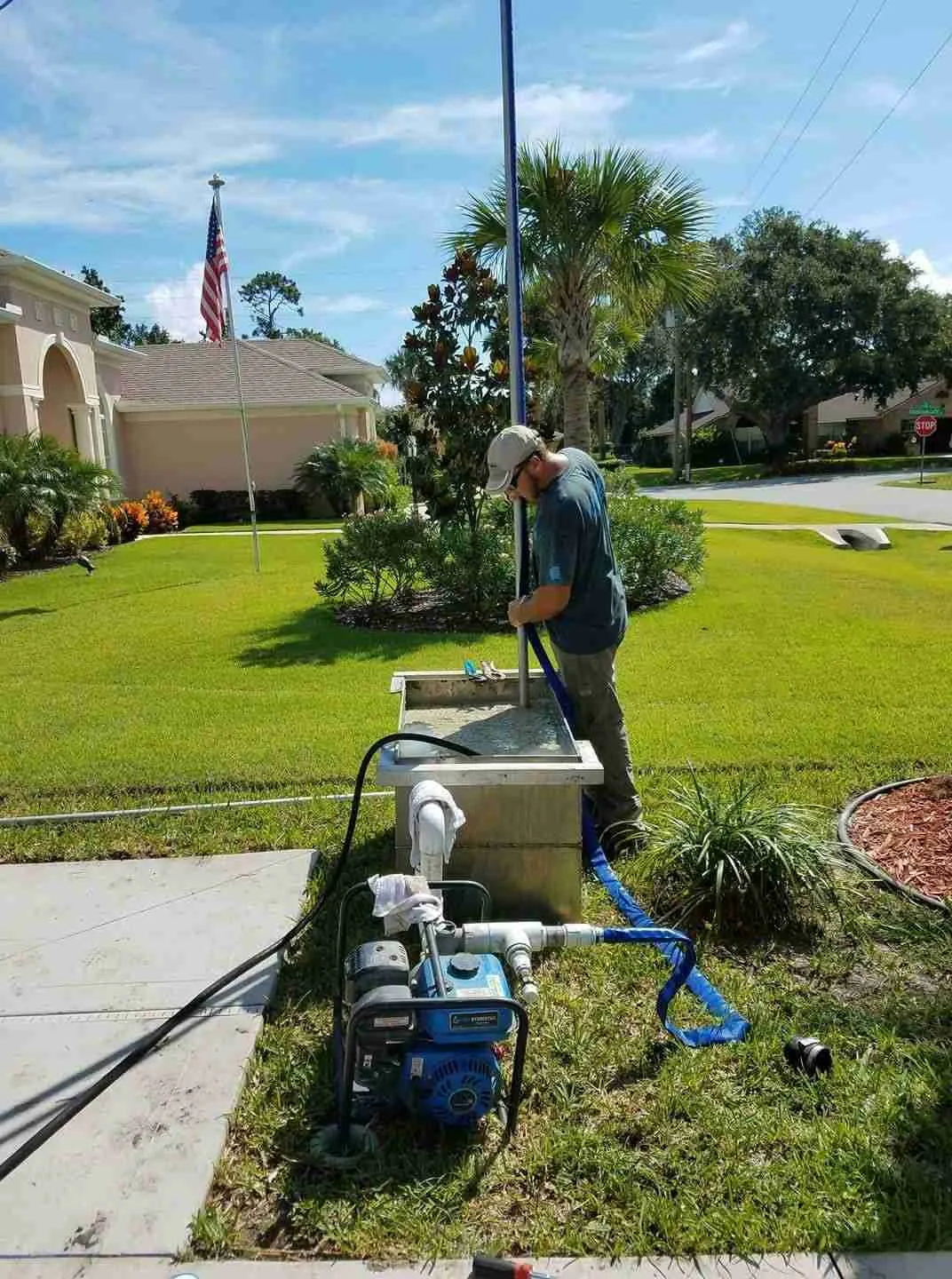 WaterCare technician guiding well pipe during a residential well installation